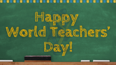 Green blackboard with the words, Happy World Teachers' Day in yellow chalk