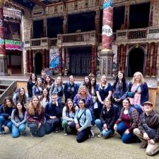 High school students pose in front of the Globe Theatre in London